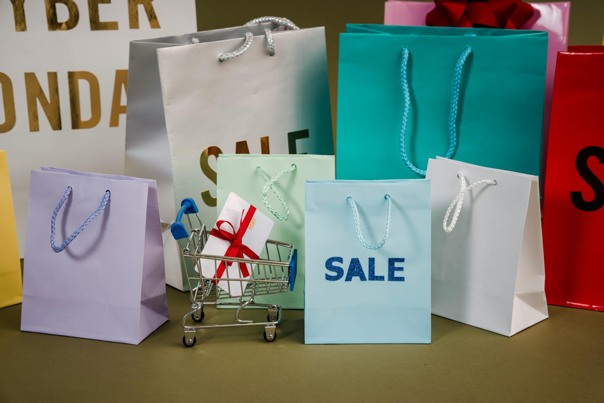 impulse buying, stop overspending | shopping bags with SALE signs